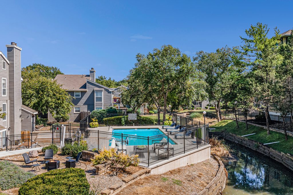 A pool deck in the midst of nature and Corinth Communities.